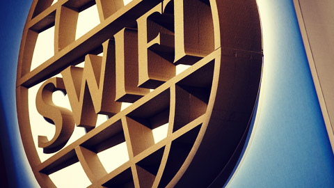 Swift hails results of blockchain pilot for corporate actions data